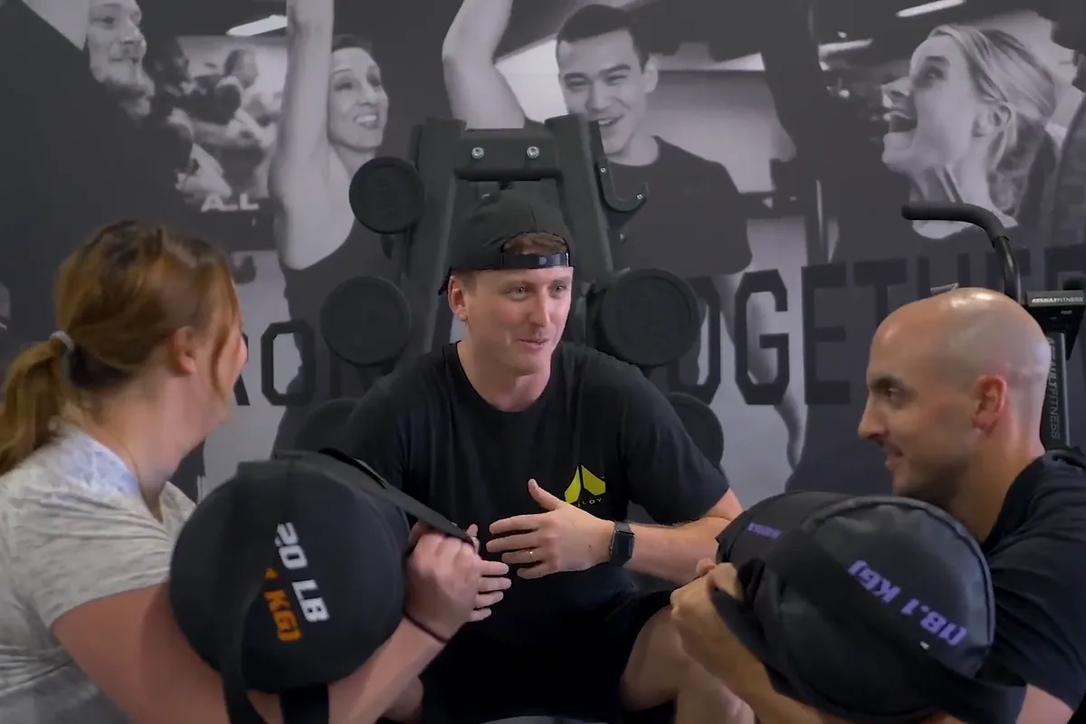 Coach leading a small group training session at Alloy Personal Training